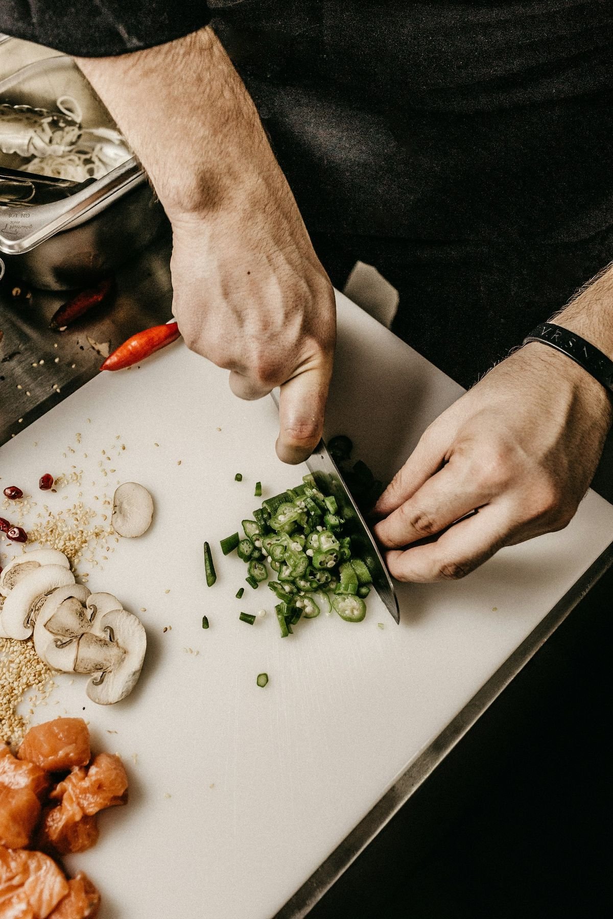 Herbs being chopped on a board
