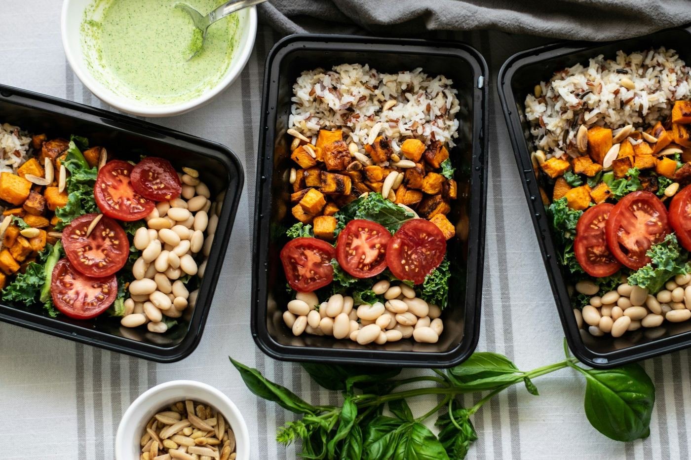 Delivery meals packed into containers and lined up ready to go